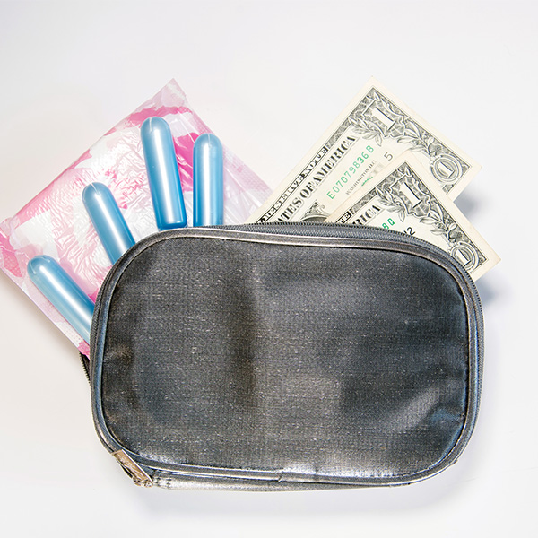 Tampons and money in a small bag.